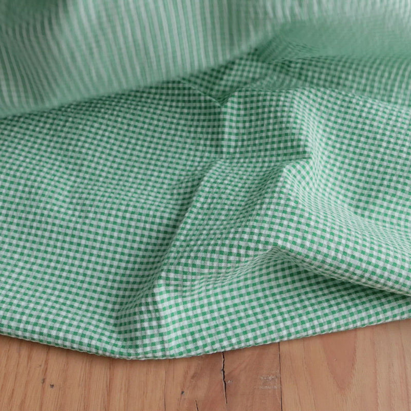 Green and white gingham seersucker fabric.