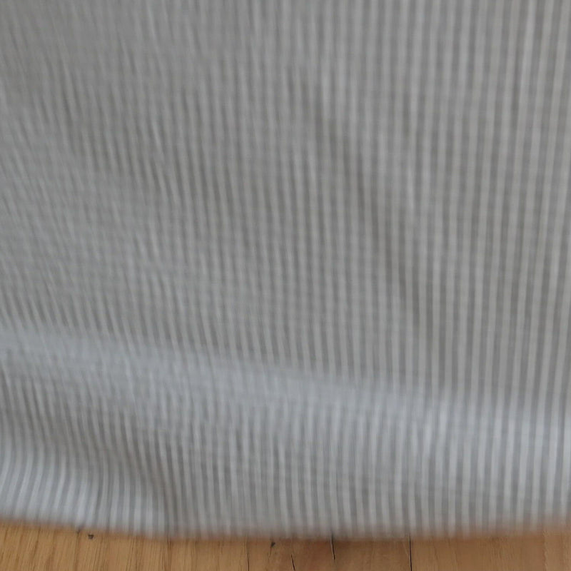 Grey and white gingham seersucker fabric.