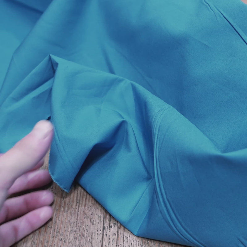 Plain, bright-blue fabric. 