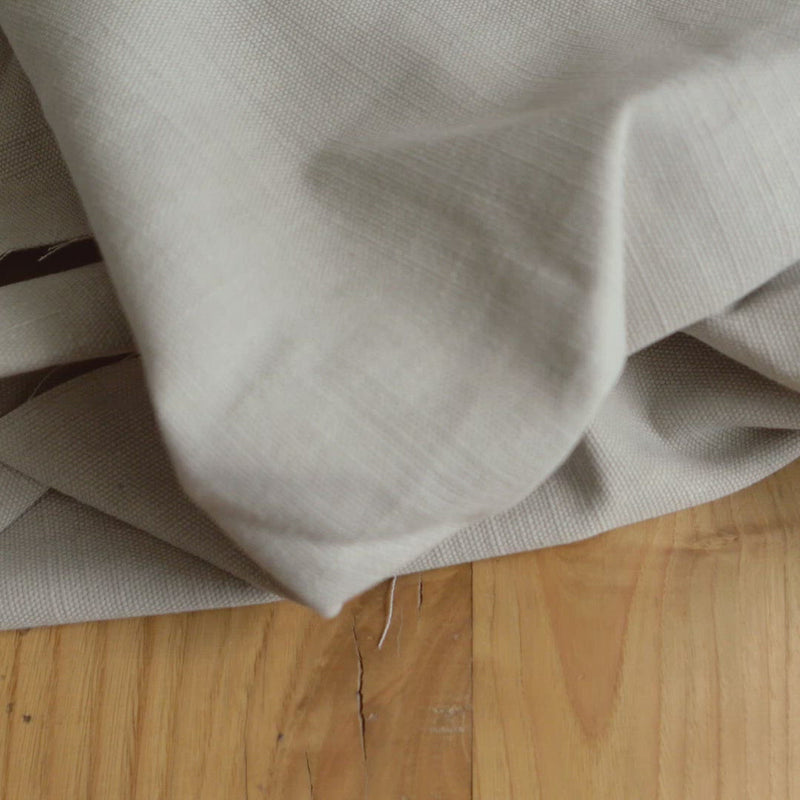 Beige fabric with a white fleck and canvas texture