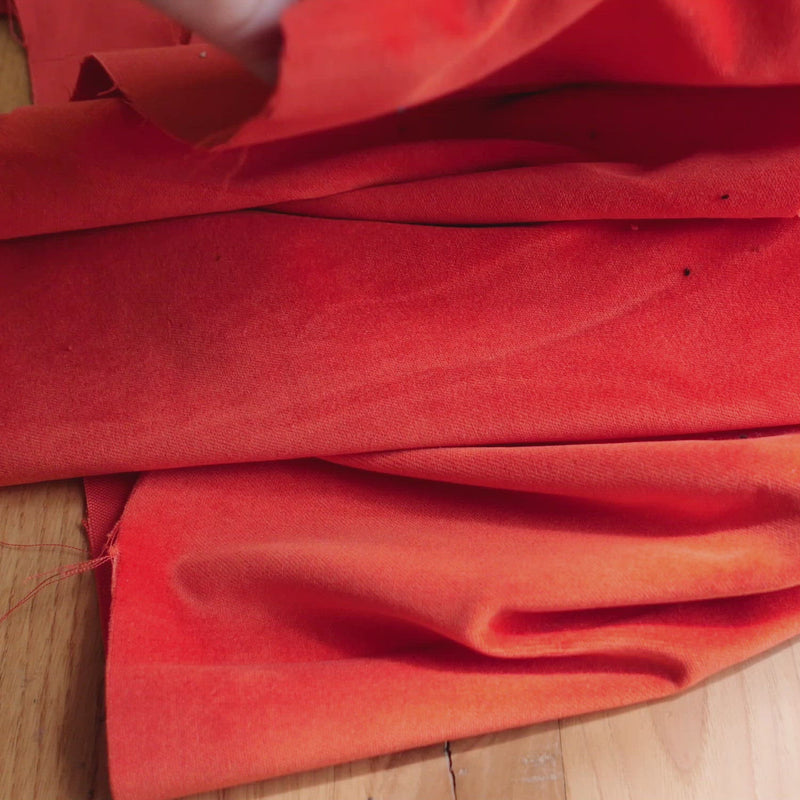 Bright orange velvet fabric.