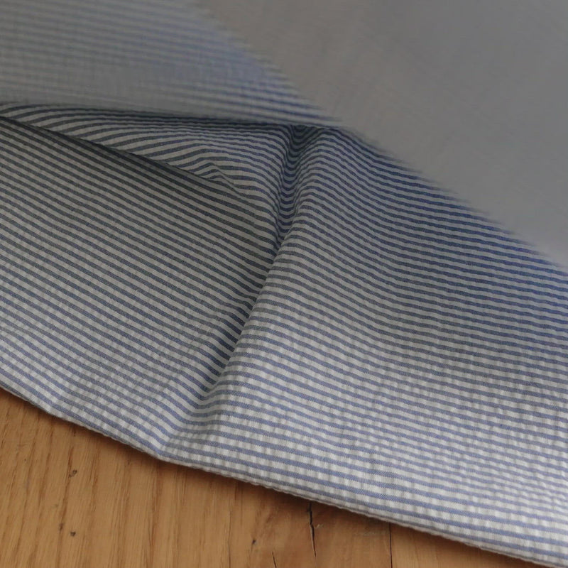 Blue and white striped seersucker fabric.