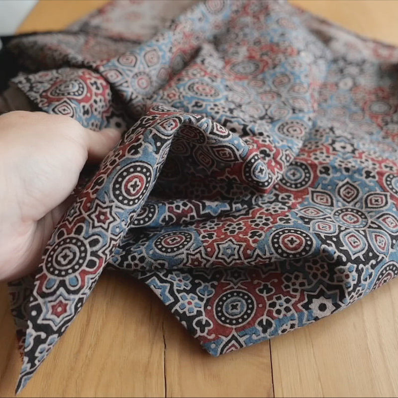 Hand crumples cotton with a block print pattern.