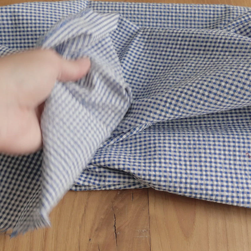 Blue and white gingham seersucker fabric.