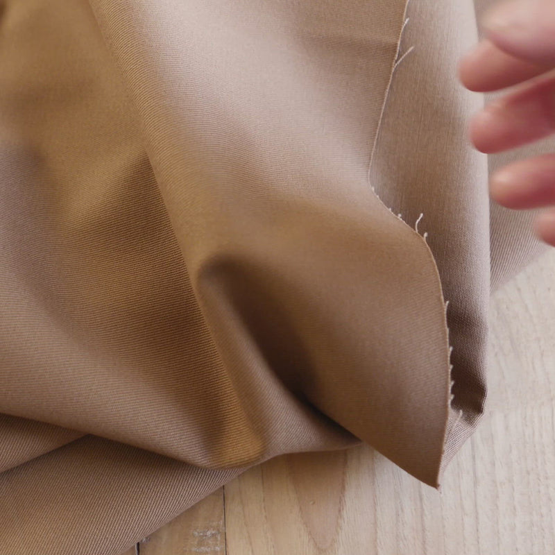 Plain brown fabric with a twill weave.