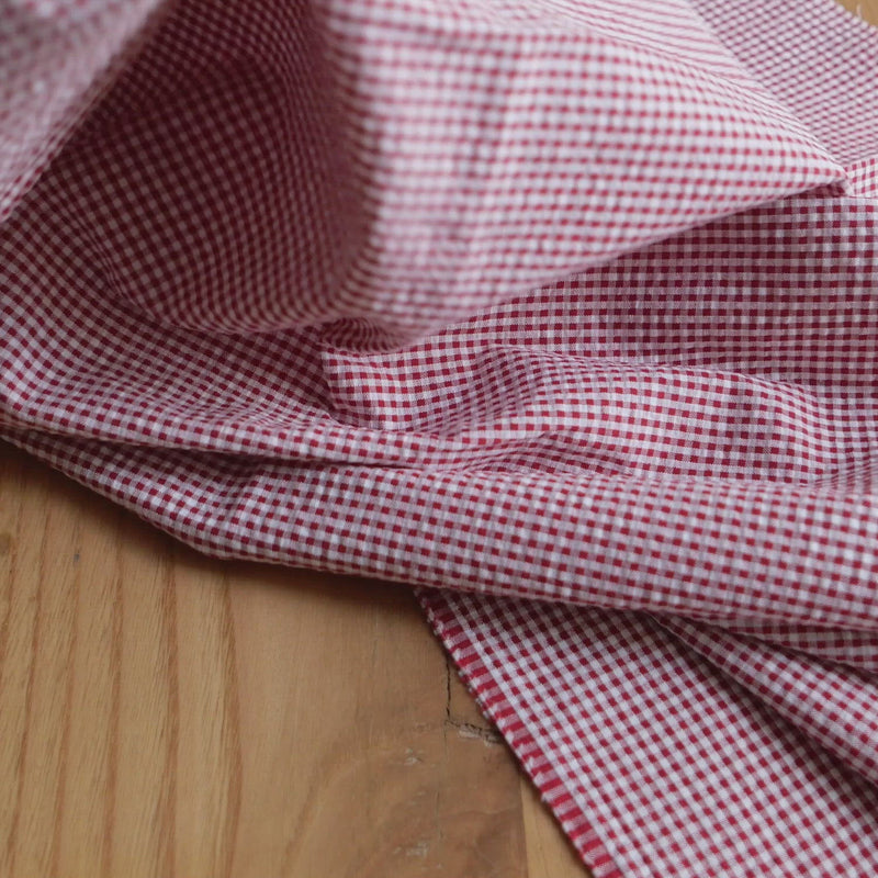 Red and white gingham seersucker fabric.