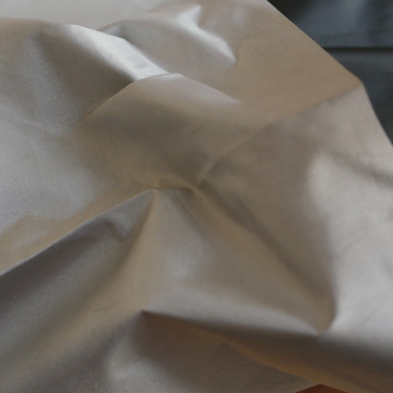 A hand crumpling lightweight nylon fabric.