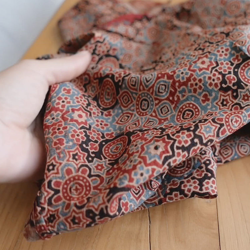 Hand crumples cotton with a block print pattern.