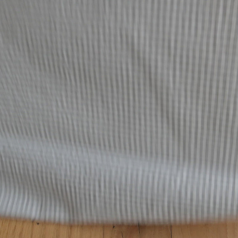 Grey and white gingham seersucker fabric.