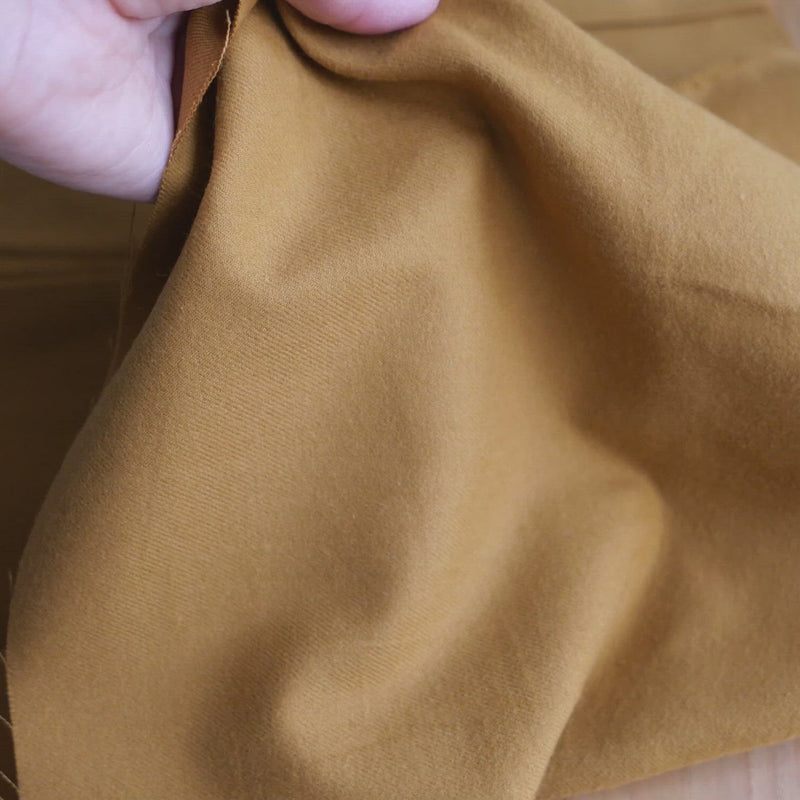 Hand crumples mustard coloured brushed cotton.