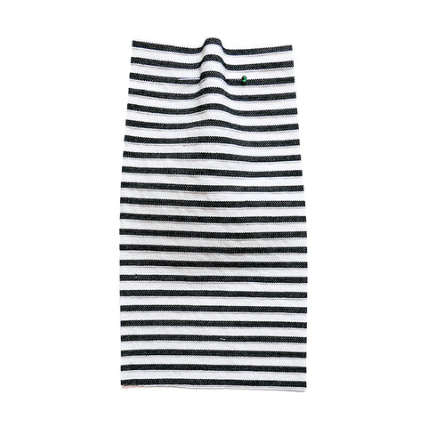 White fabric with a woven black stripe.