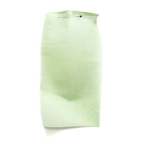 Light green cotton fabric with a sheer, paper-like texture.