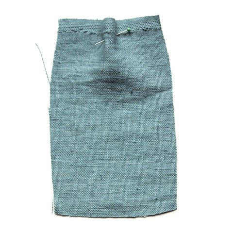 Light blue fabric with a slubby texture.