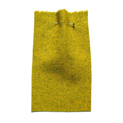Acid yellow wool fabric with a flat weave.