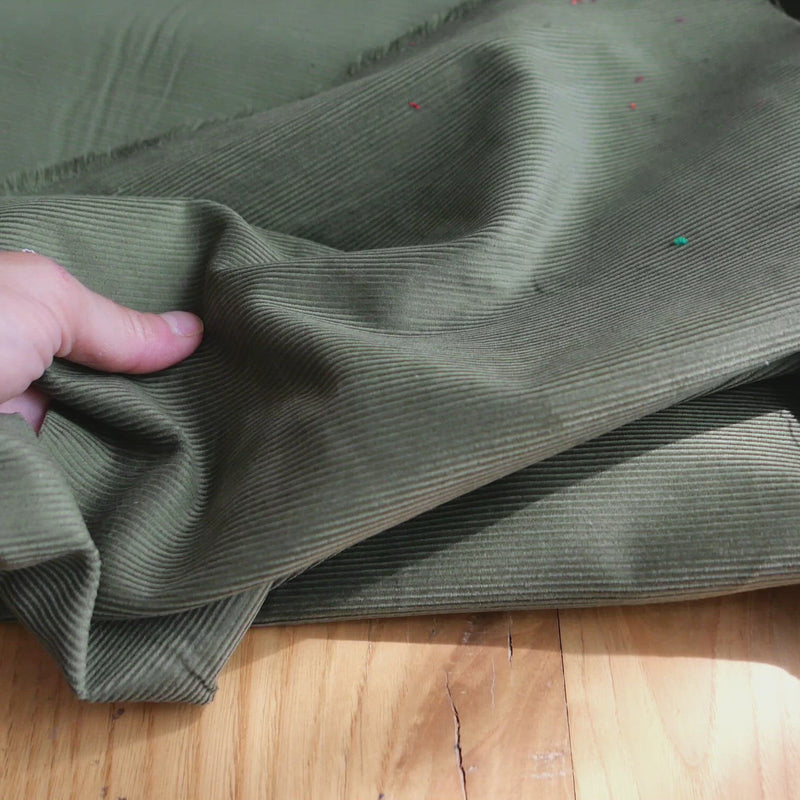 Khaki green corduroy fabric.