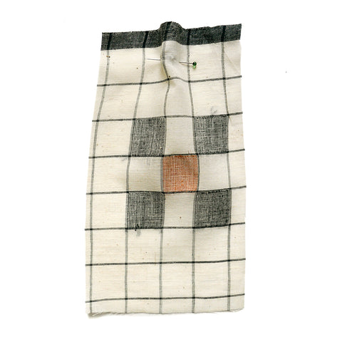 Cream fabric with a woven black check, embroidered with squares..