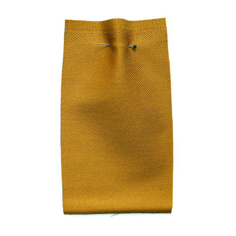 Plain yellow fabric with a twill weave.