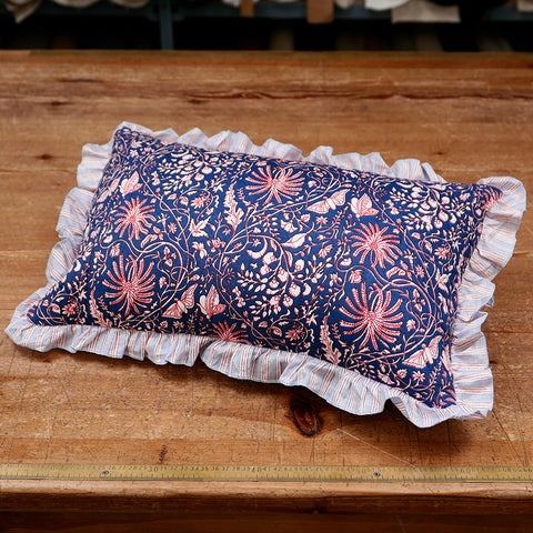 Quilted cotton cushion with a floral print and striped frill.