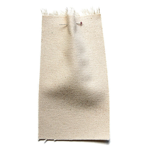Plain cream fabric with a canvas texture. 