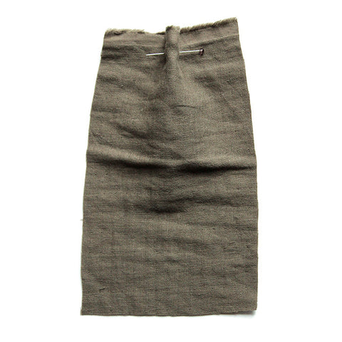 Khaki green fabric with a soft crumpled texture. 