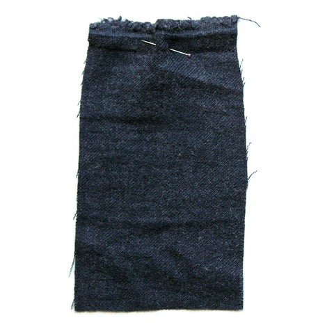 Plain blue, wooly-looking fabric, with a twill weave.
