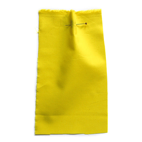 Plain, acid-yellow fabric. 