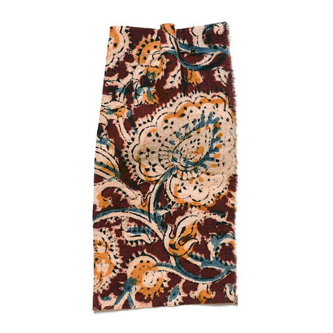 Printed floral fabric with a brown ground and yellow detail. 