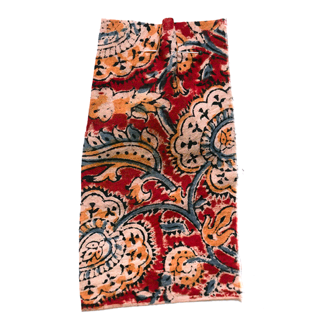 Printed floral fabric with a red ground and blue vine detail. 