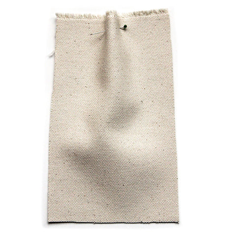 Undyed fabric with a canvas texture and a natural fleck.