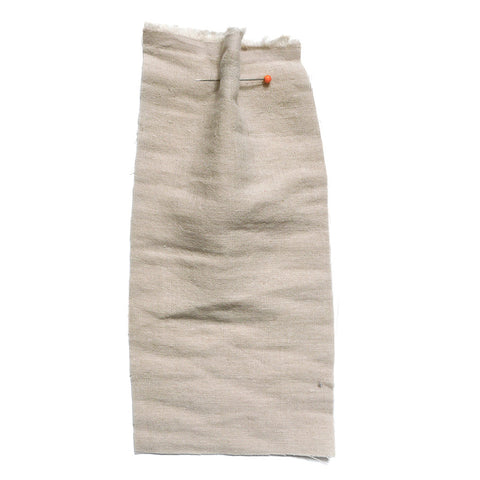 Beige fabric with a soft crumpled texture. 