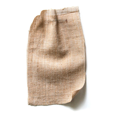 Beige chambray fabric with a linen-like texture.