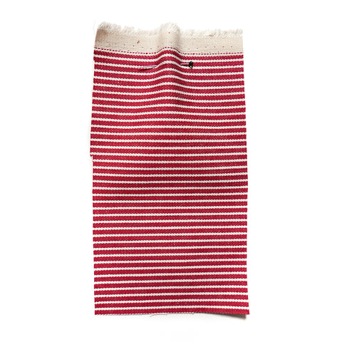 Red denim fabric with cream stripes.