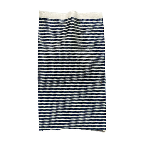 Blue denim fabric with cream stripes.