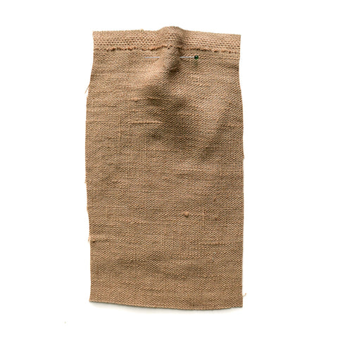 Khaki brown fabric with a slubby texture.