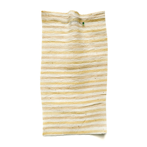 Cotton with light yellow stripes.