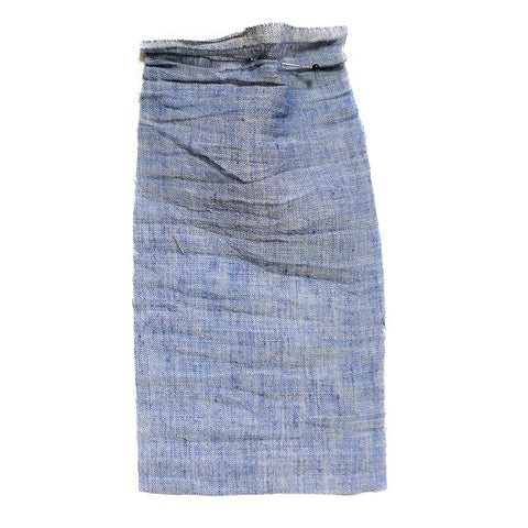 Light blue chambray fabric with a washed and crumpled texture.