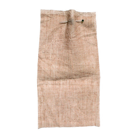 Beige chambray fabric with a washed and crumpled texture.
