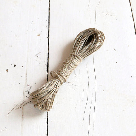 A skein of natural linen string.