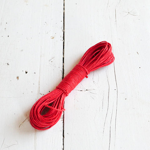 A skein of red linen string.