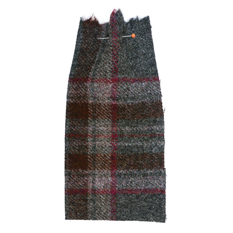 Grey, woolly fabric with a red check. 