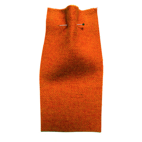 Orange fabric with a woolly texture. 