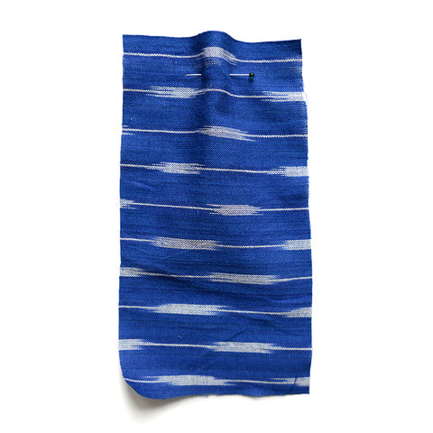 Blue fabric with a white woven striped pattern. 