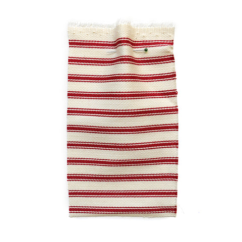Cream herringbone fabric with a red ticking stripe.