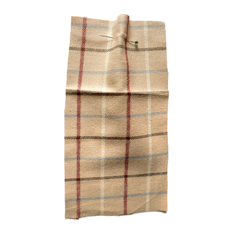 Brown brushed cotton with a red, cream and grey check.