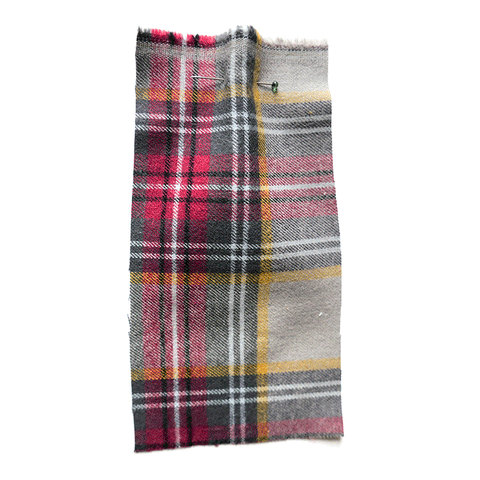 Grey brushed cotton with a red, yellow and grey tartan check.