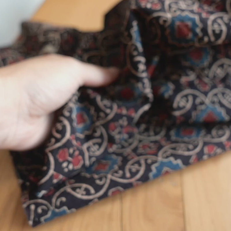Hand crumples cotton with a block print motif.