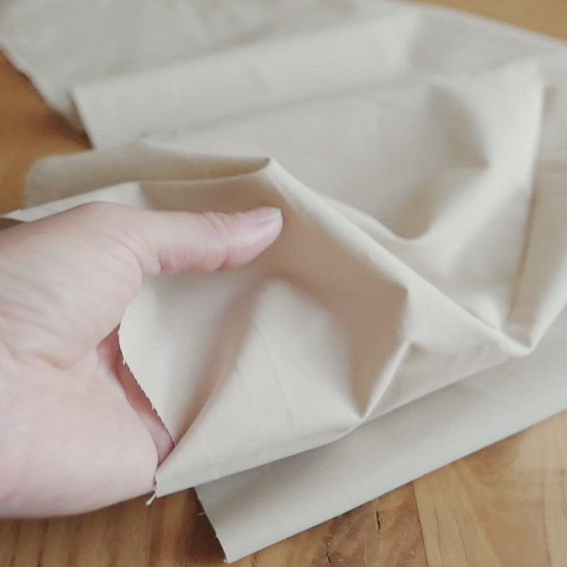Plain beige fabric. 