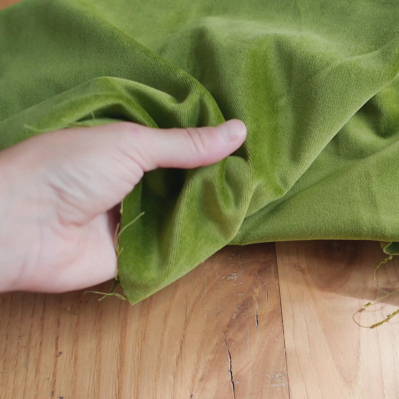 Green velvet fabric.