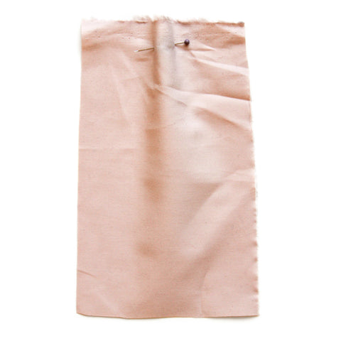 Plain, light-pink fabric. 